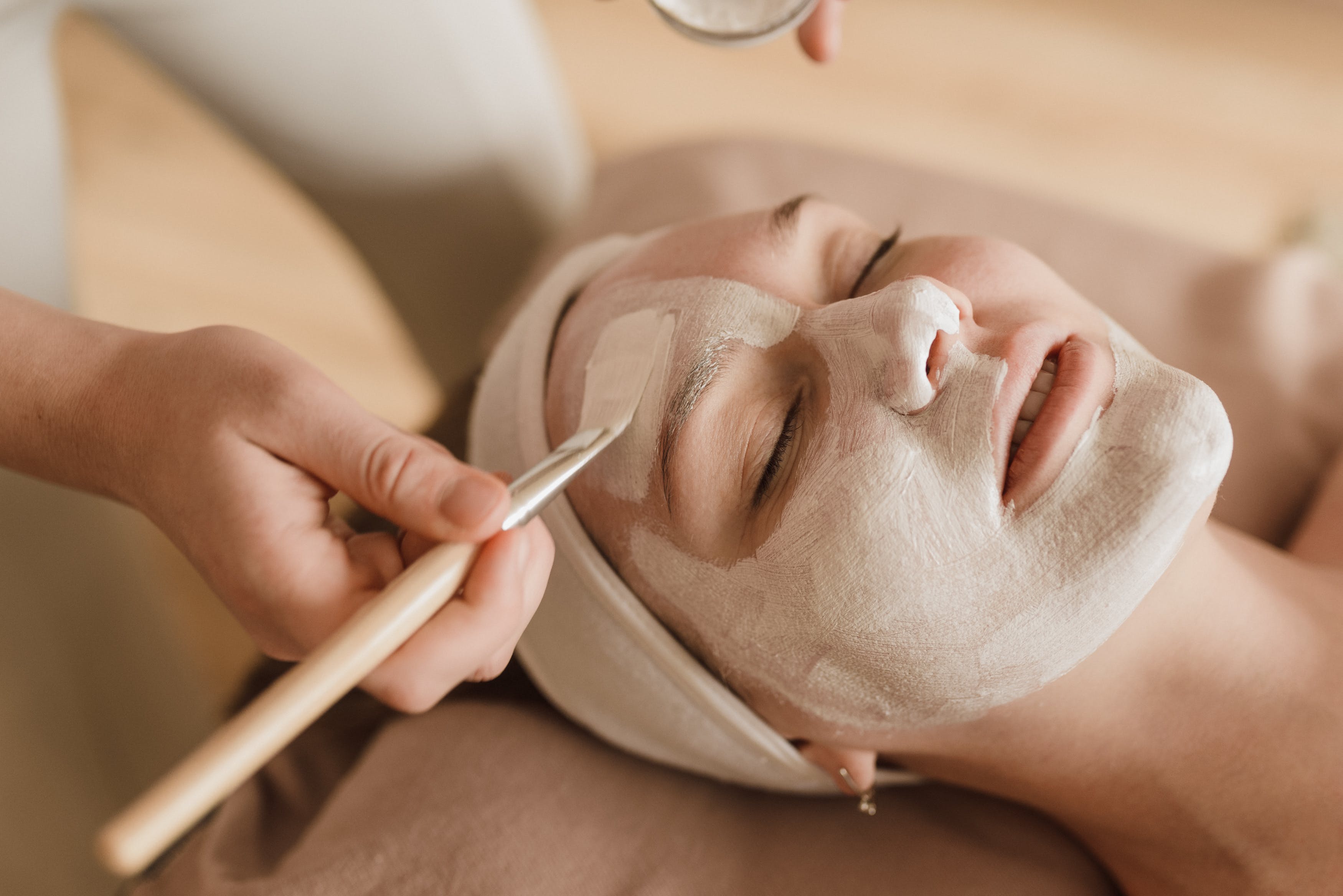 Spa professional administering a rejuvenating facial treatment